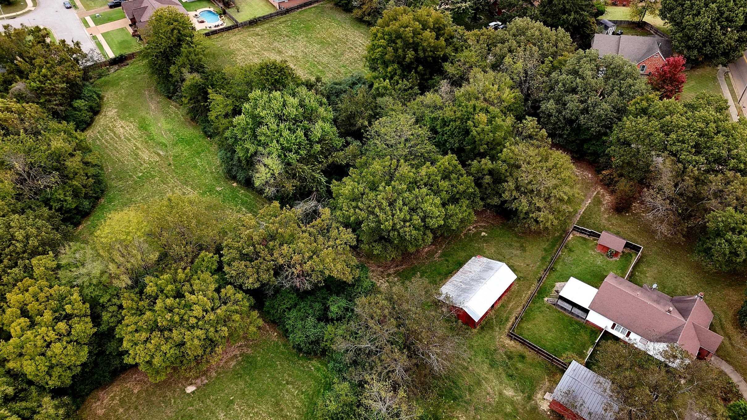 450 Fletcher Road Collierville, TN 38017 - Photo 2 of 5 an aerial view of residential house with outdoor space and trees all around