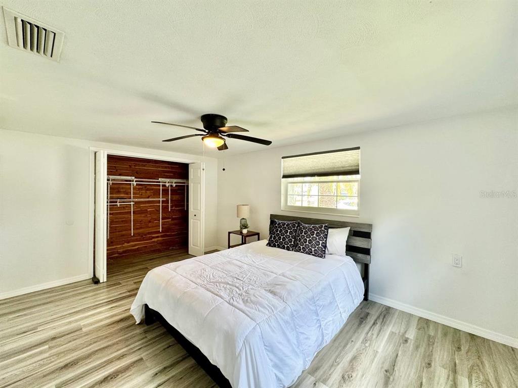 4282 Rudder Way New Port Richey, FL 34652 - Photo 14 of 34 a bedroom with a bed and a window
