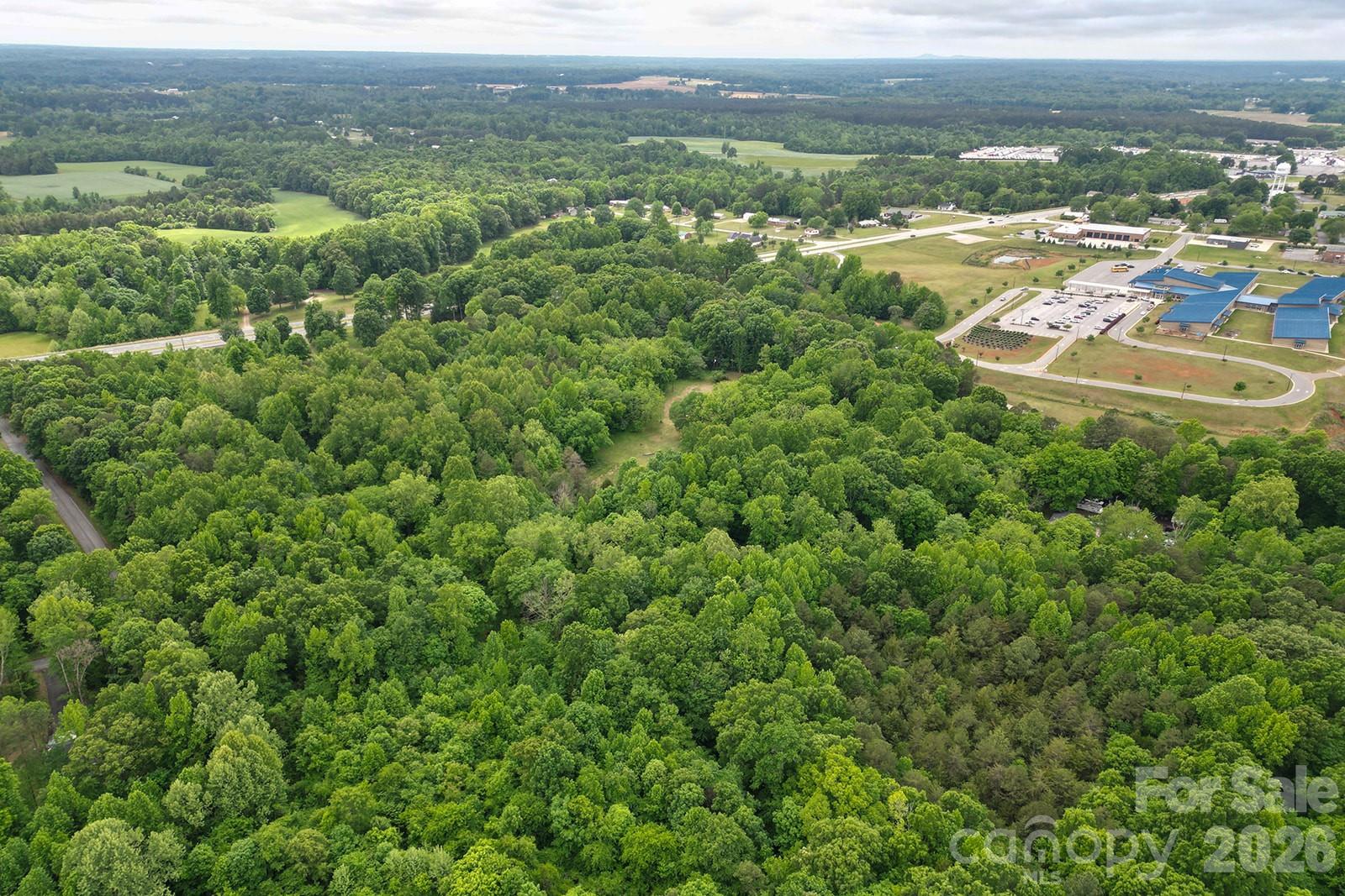2 Mimosa Street Cleveland, NC 27013 - Photo 1 of 1 an aerial view of residential houses with outdoor space and trees