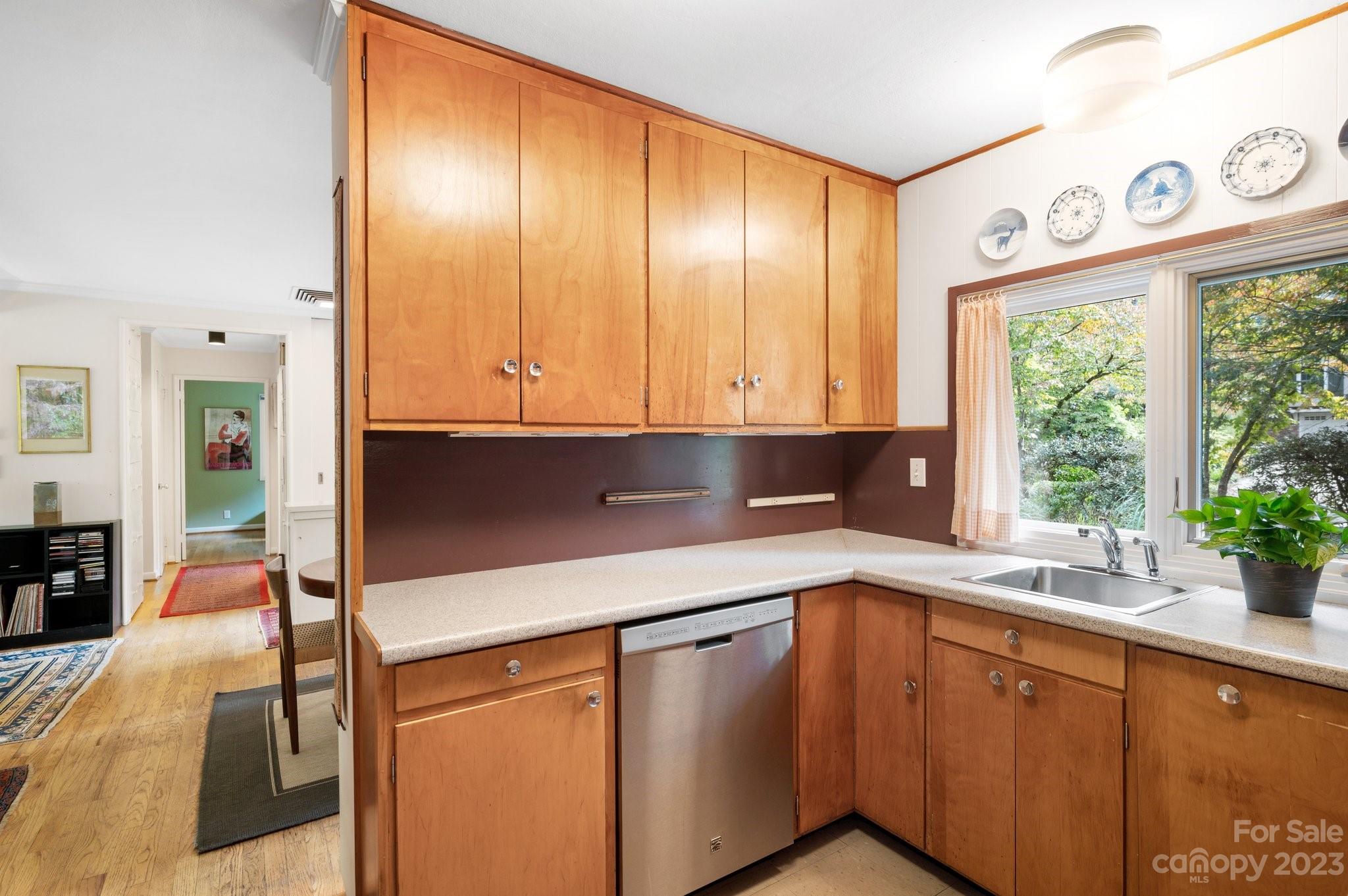 112 Hilltop Road Black Mountain, NC 28711 - Photo 14 of 34 a kitchen with stainless steel appliances granite countertop a sink and a cabinets