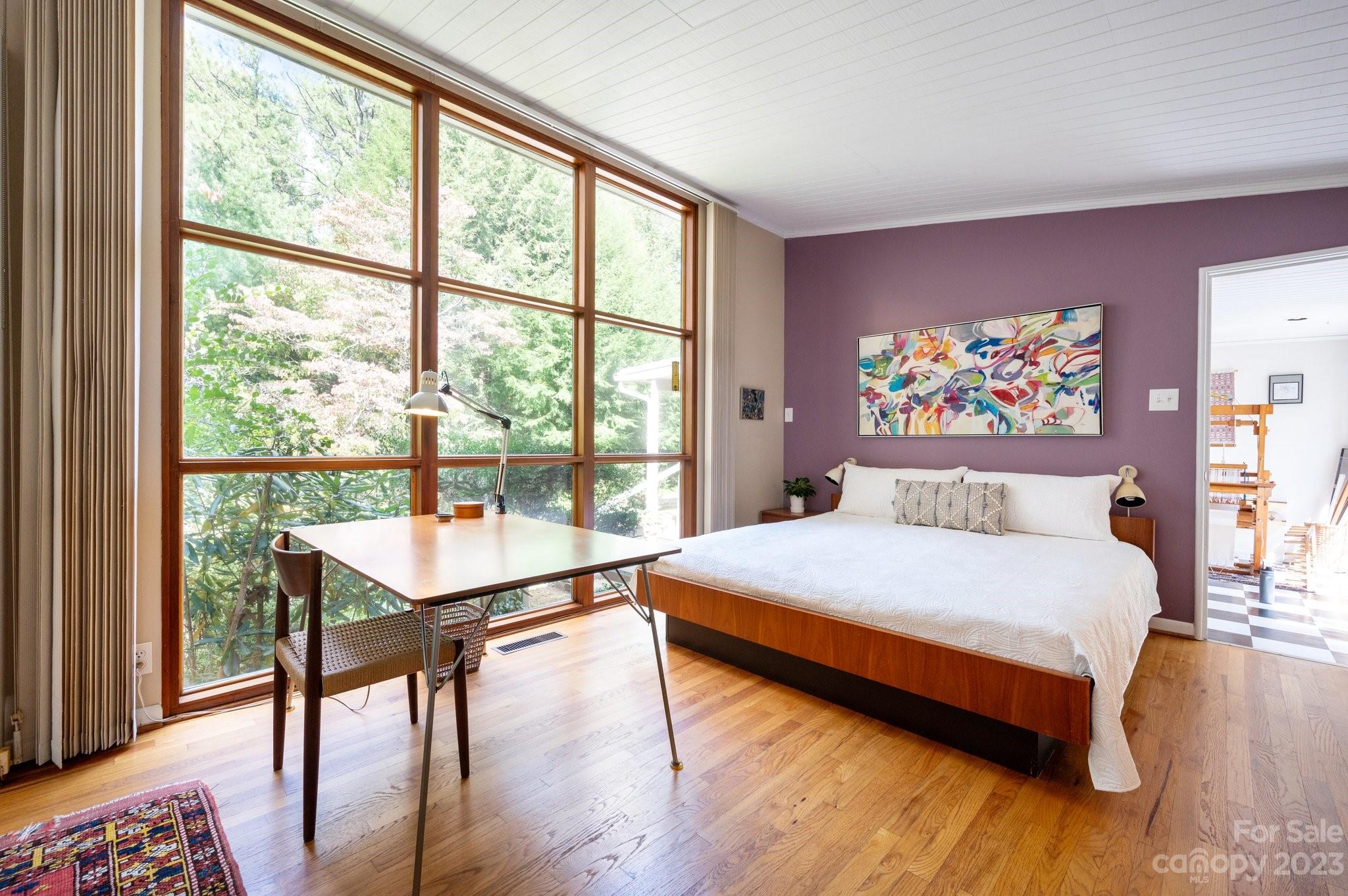 112 Hilltop Road Black Mountain, NC 28711 - Photo 17 of 34 a bedroom with a large bed and a large window