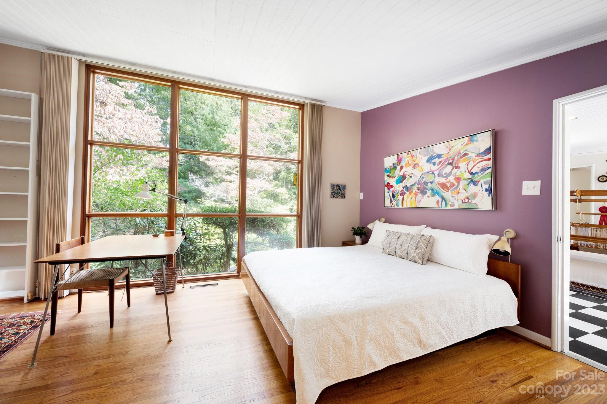 112 Hilltop Road Black Mountain, NC 28711 - Photo 20 of 34 a bedroom with a large window and a bed