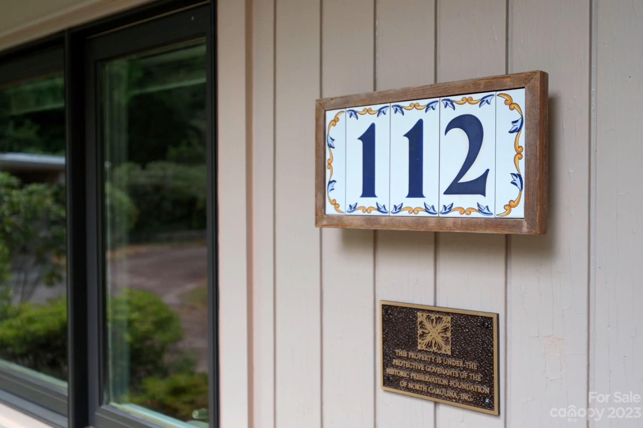 112 Hilltop Road Black Mountain, NC 28711 - Photo 2 of 34 a view of a door with a street sign