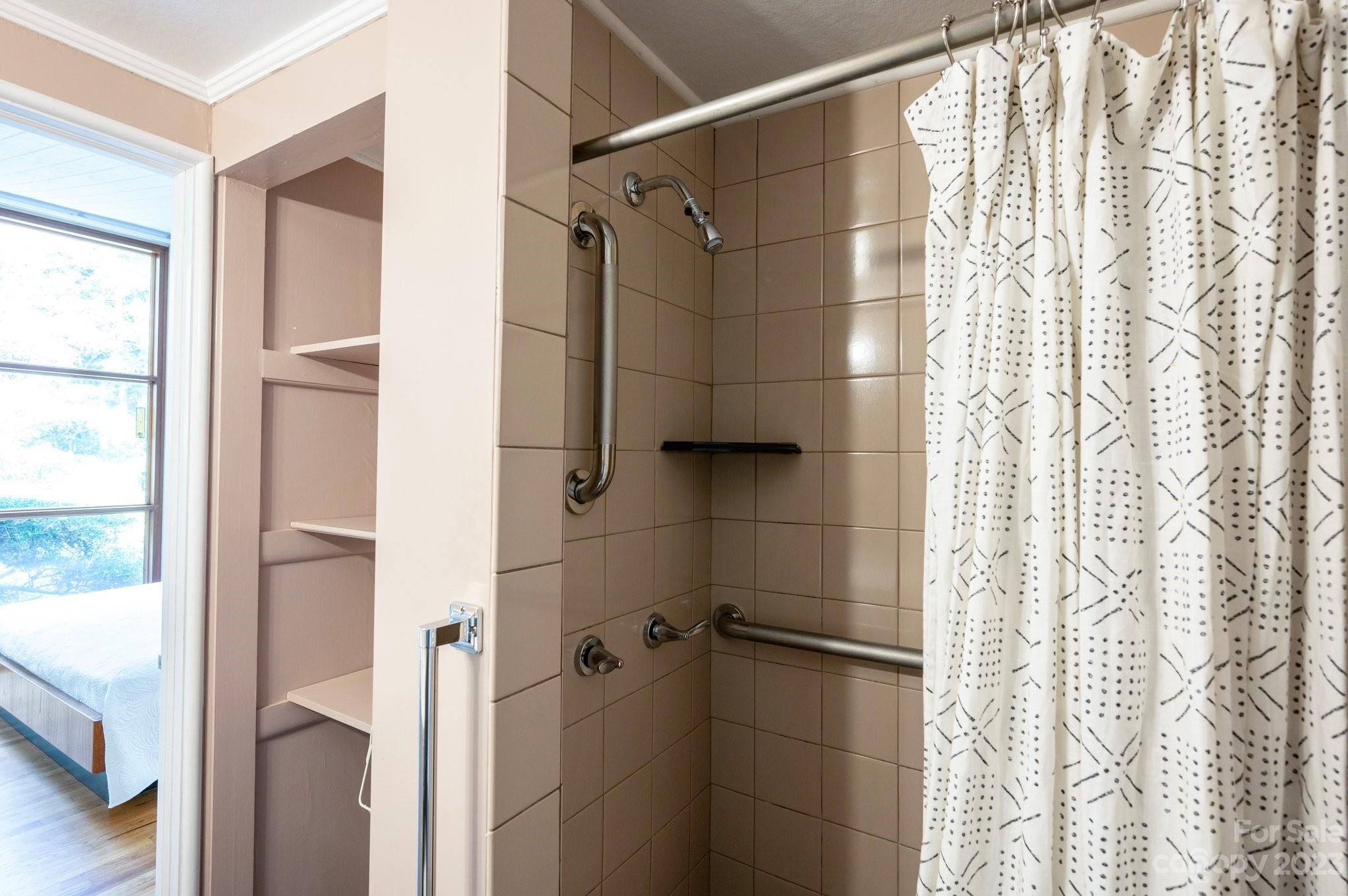 112 Hilltop Road Black Mountain, NC 28711 - Photo 22 of 34 a bathroom with a shower and a tub