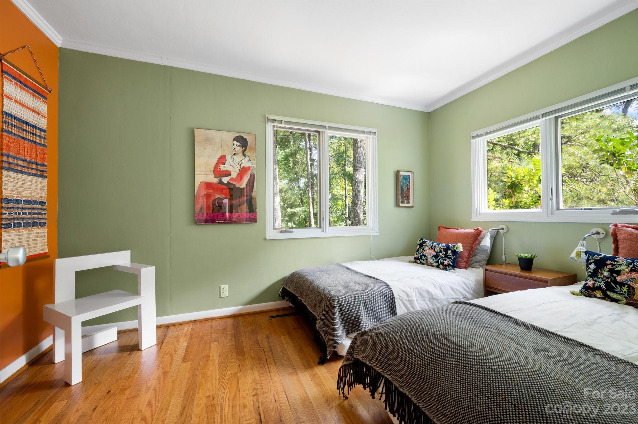 112 Hilltop Road Black Mountain, NC 28711 - Photo 26 of 34 a bedroom with two beds and a wooden floor