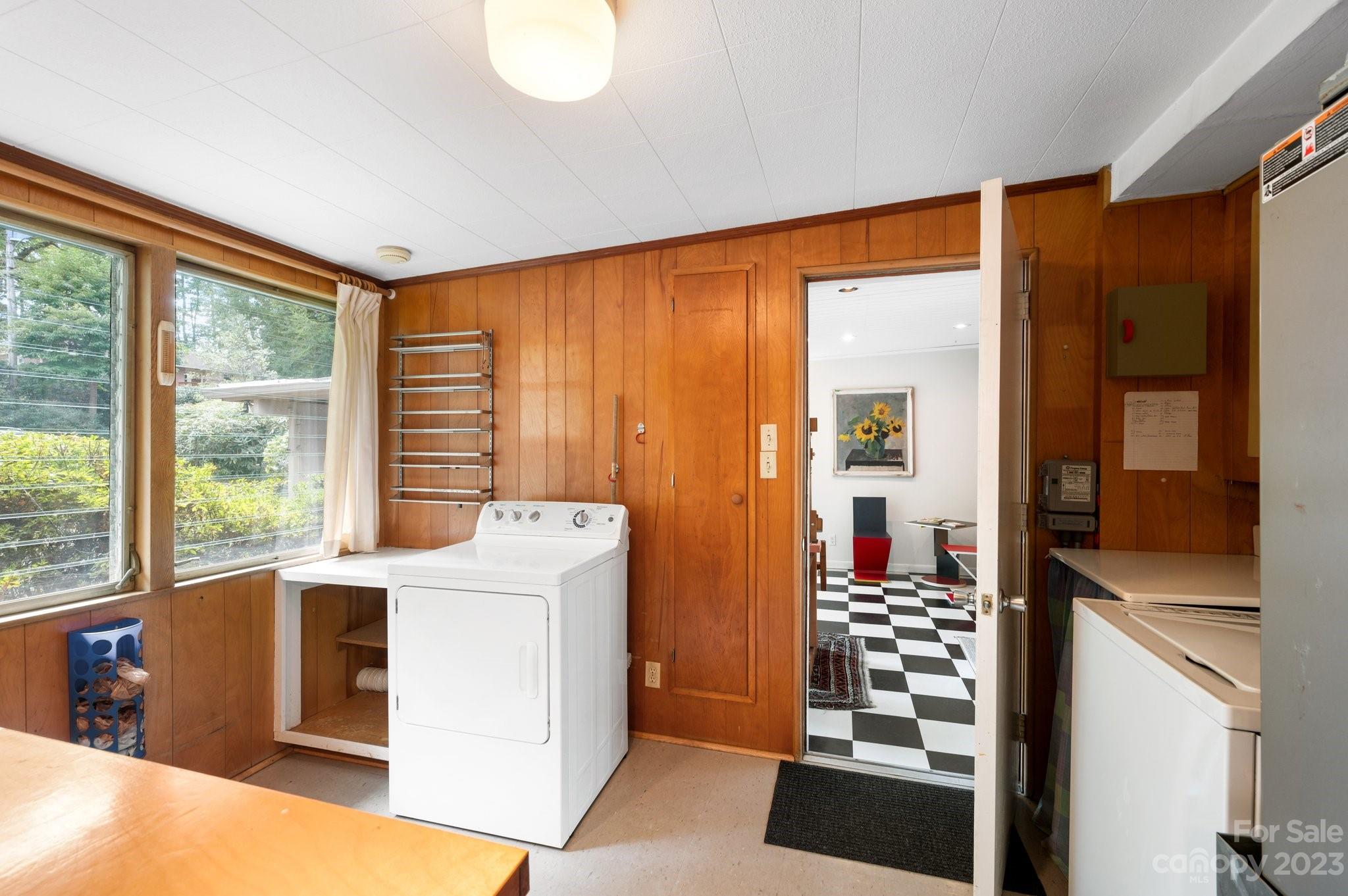 112 Hilltop Road Black Mountain, NC 28711 - Photo 28 of 34 a living room with furniture and a floor to ceiling window