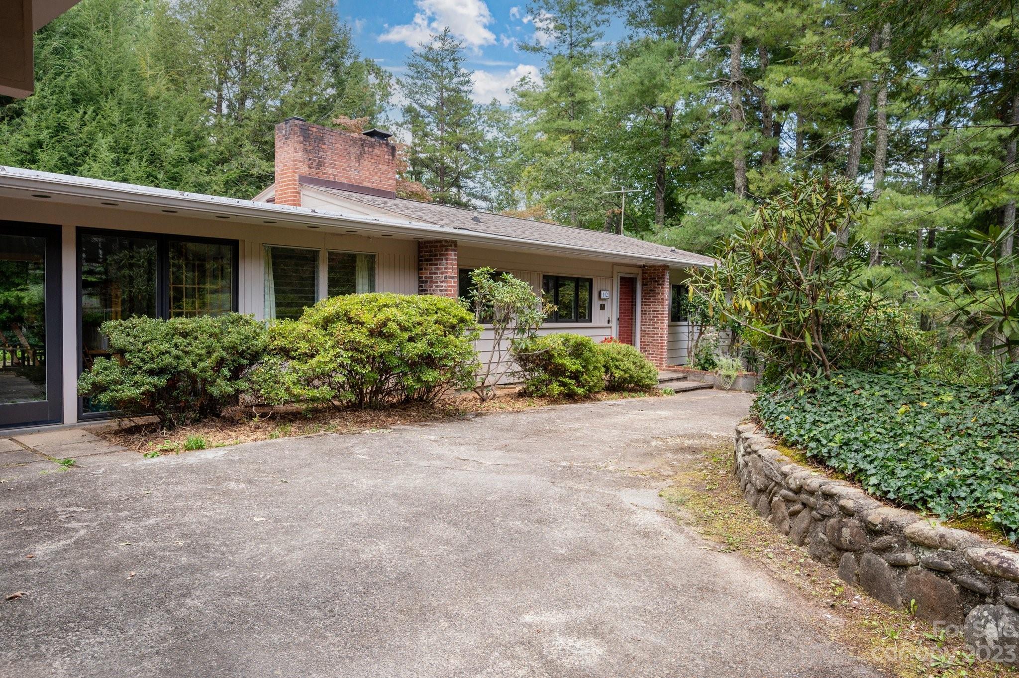 112 Hilltop Road Black Mountain, NC 28711 - Photo 3 of 34 front view of a house with a yard