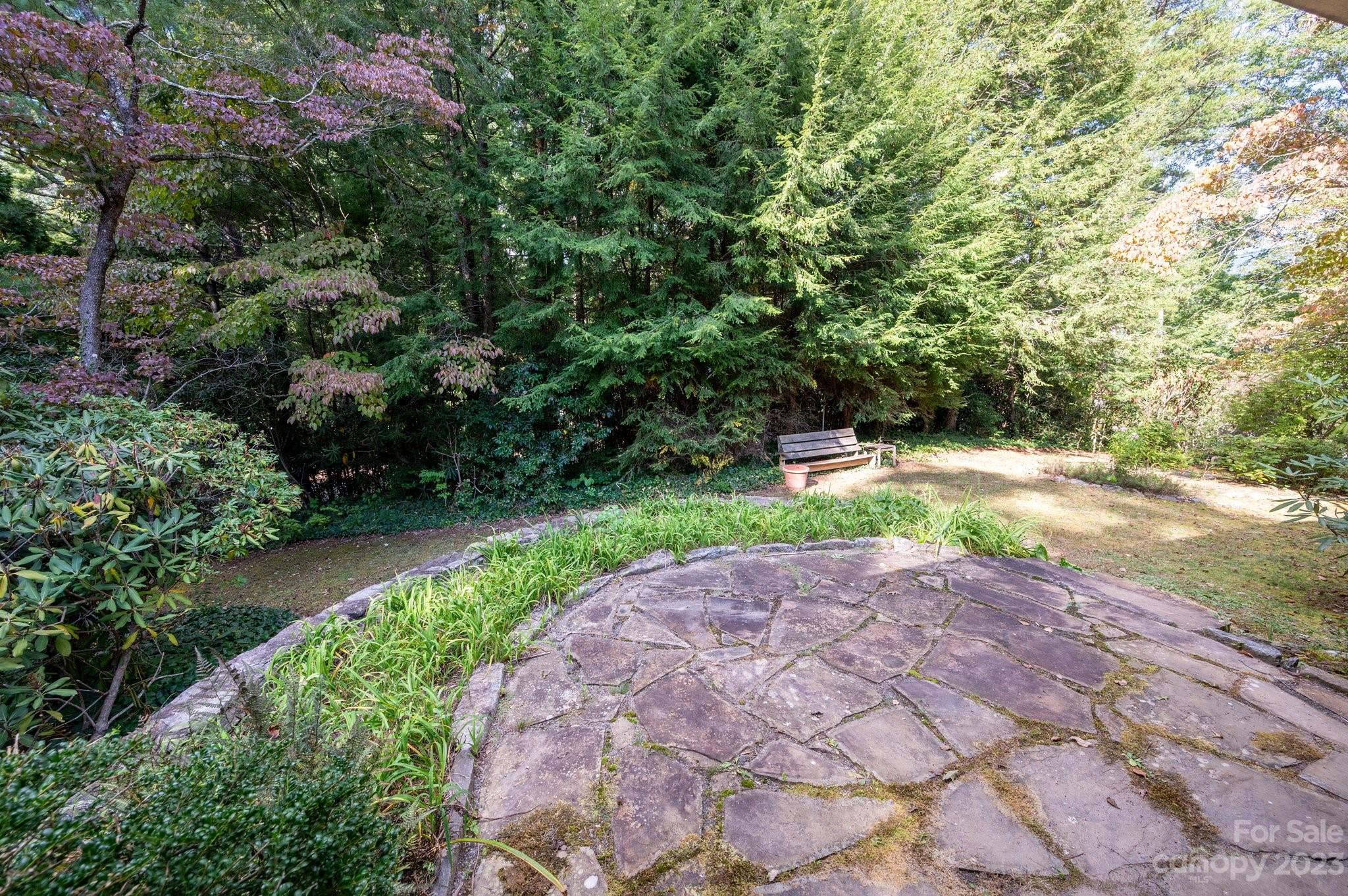 112 Hilltop Road Black Mountain, NC 28711 - Photo 32 of 34 a view of a backyard with a garden