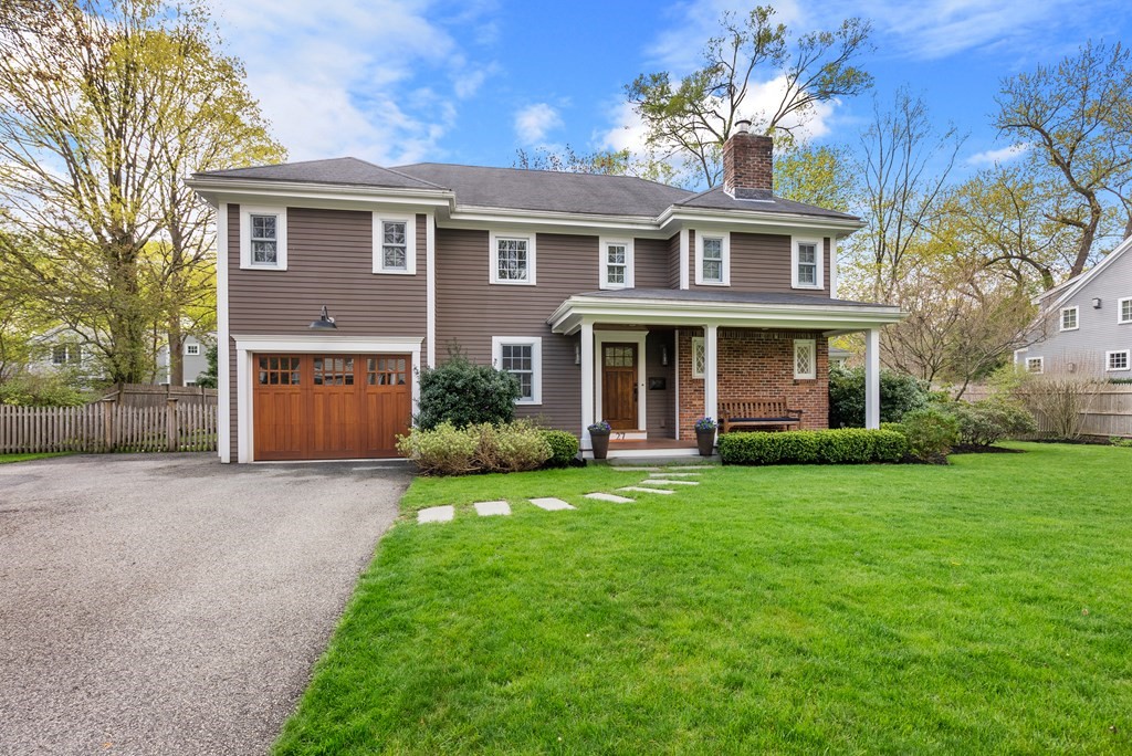 27 Boulder Brook Road Wellesley, MA 02481 - Photo 36 of 41 a front view of a house with a garden and yard