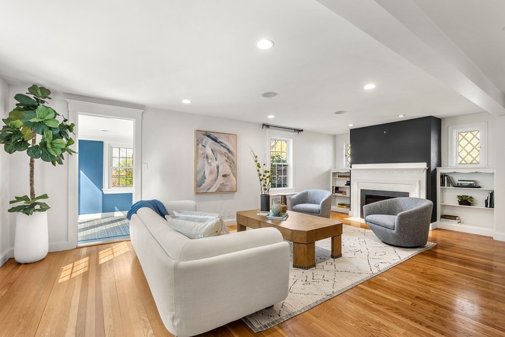 27 Boulder Brook Road Wellesley, MA 02481 - Photo 6 of 41 a living room with fireplace furniture and a potted plant