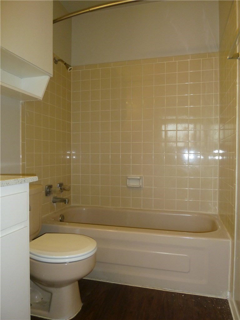 3000 Guadalupe Street, Unit 313 Austin, TX 78705 - Photo 11 of 14 a bathroom with a toilet a sink and shower