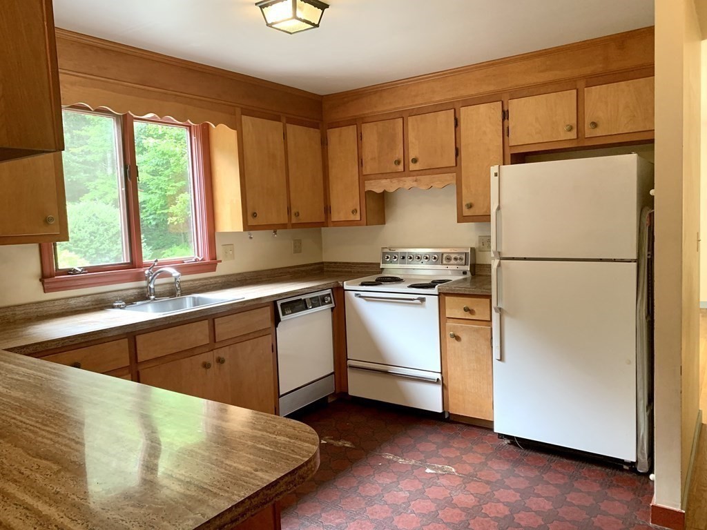 40 Prospect Street Rutland, MA 01543 - Photo 11 of 33 a kitchen with white cabinets and white appliances