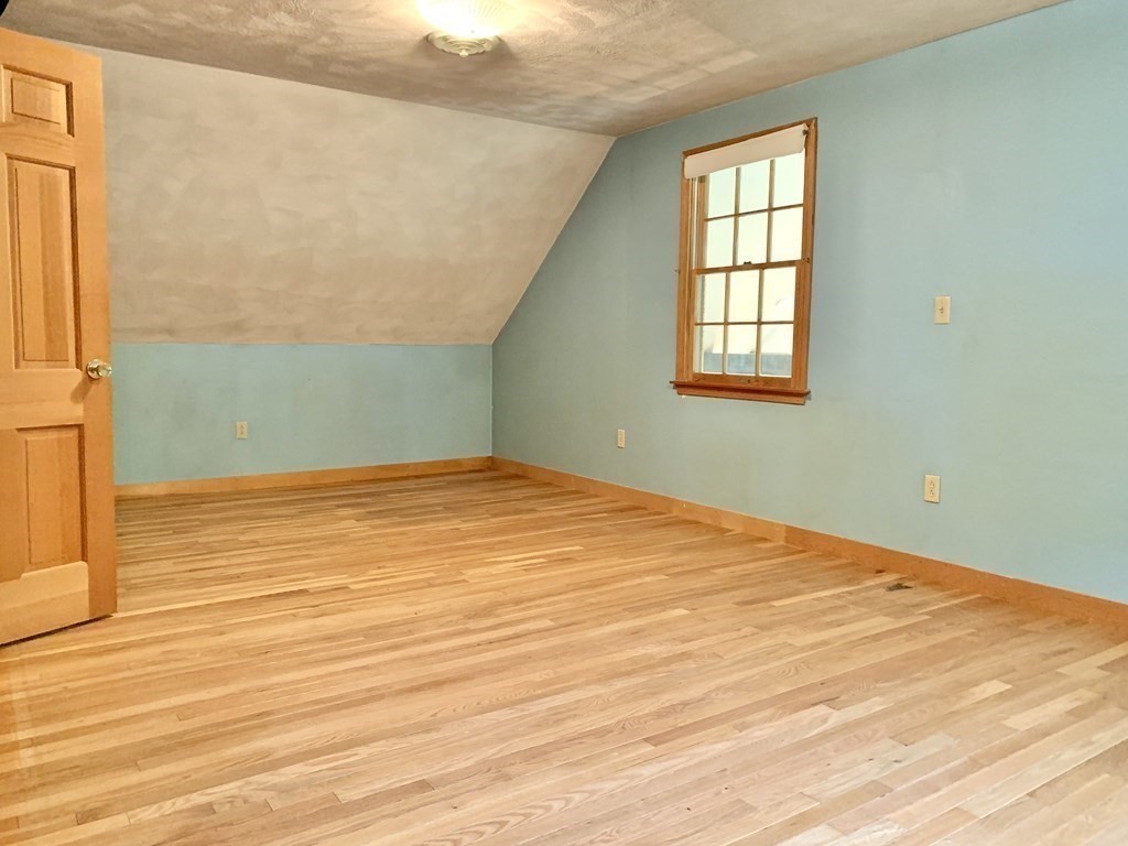 40 Prospect Street Rutland, MA 01543 - Photo 18 of 33 an empty room with wooden floor and windows
