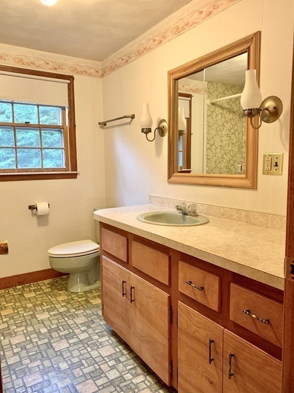 40 Prospect Street Rutland, MA 01543 - Photo 23 of 33 a bathroom with a sink a toilet and a window