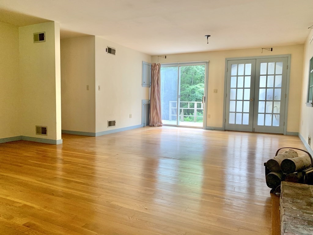 40 Prospect Street Rutland, MA 01543 - Photo 8 of 33 a view of a room with wooden floor and floor to ceiling window