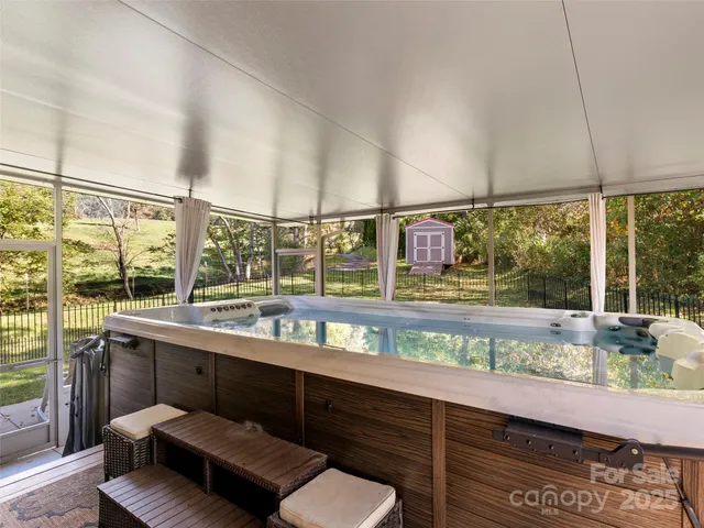 a kitchen with a sink and wooden floor