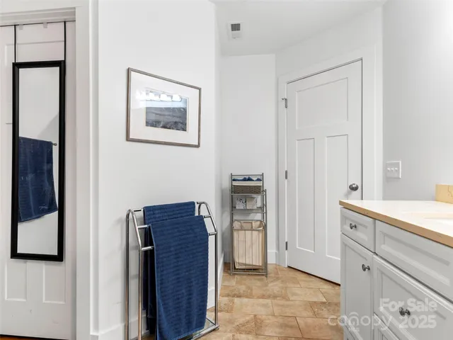 a room with a bed and a cabinets