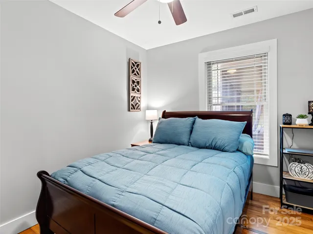 a bedroom with a bed and a book shelf