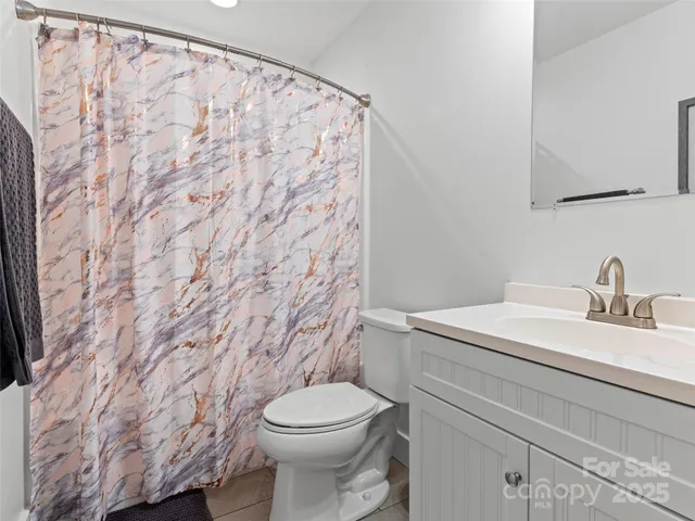 a bathroom with a toilet and a sink