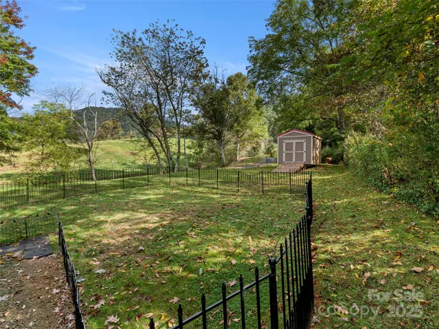 a backyard of a house with lots of green space