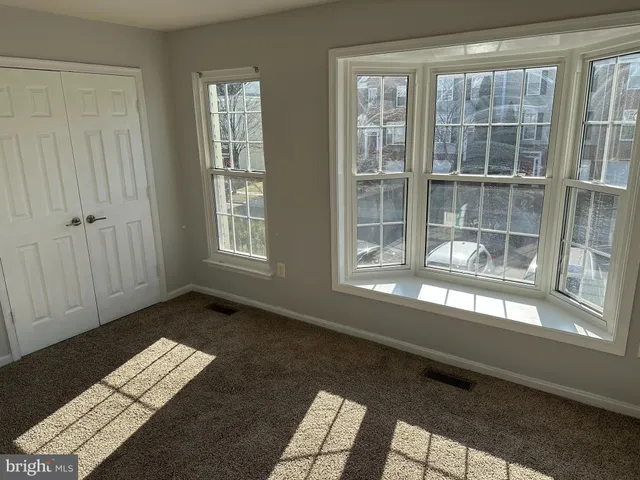 a view of empty room with windows
