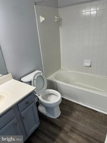 a bathroom with a toilet a sink and bathtub
