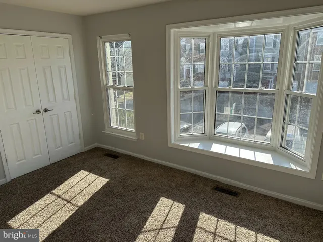 a view of empty room with windows