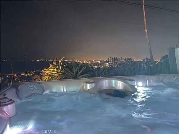 a kitchen with a table and chairs