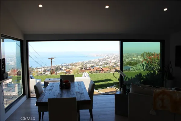 a view of a floor to ceiling window and wooden floor