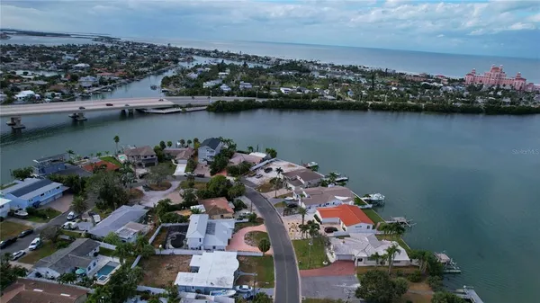 an aerial view of a city with ocean view