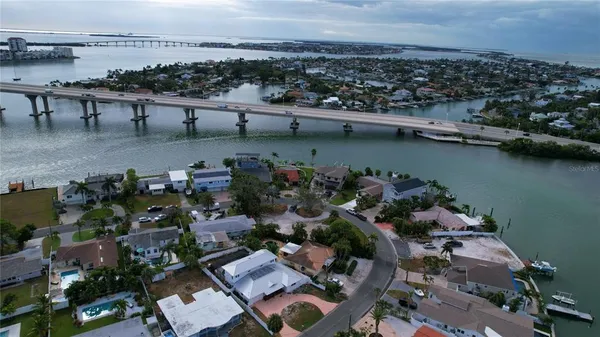 an aerial view of a house with a lake view