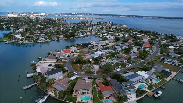 an aerial view of a city with ocean view
