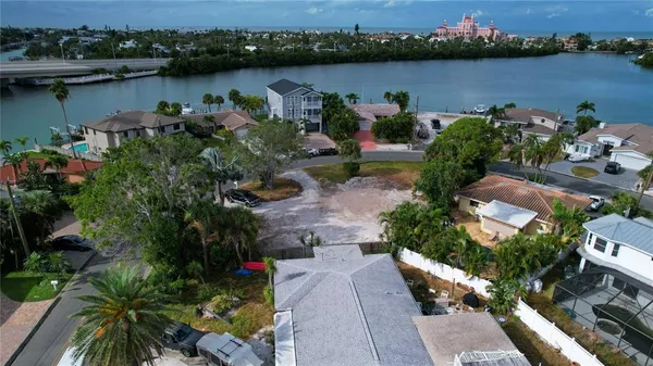 an aerial view of a house with a lake view