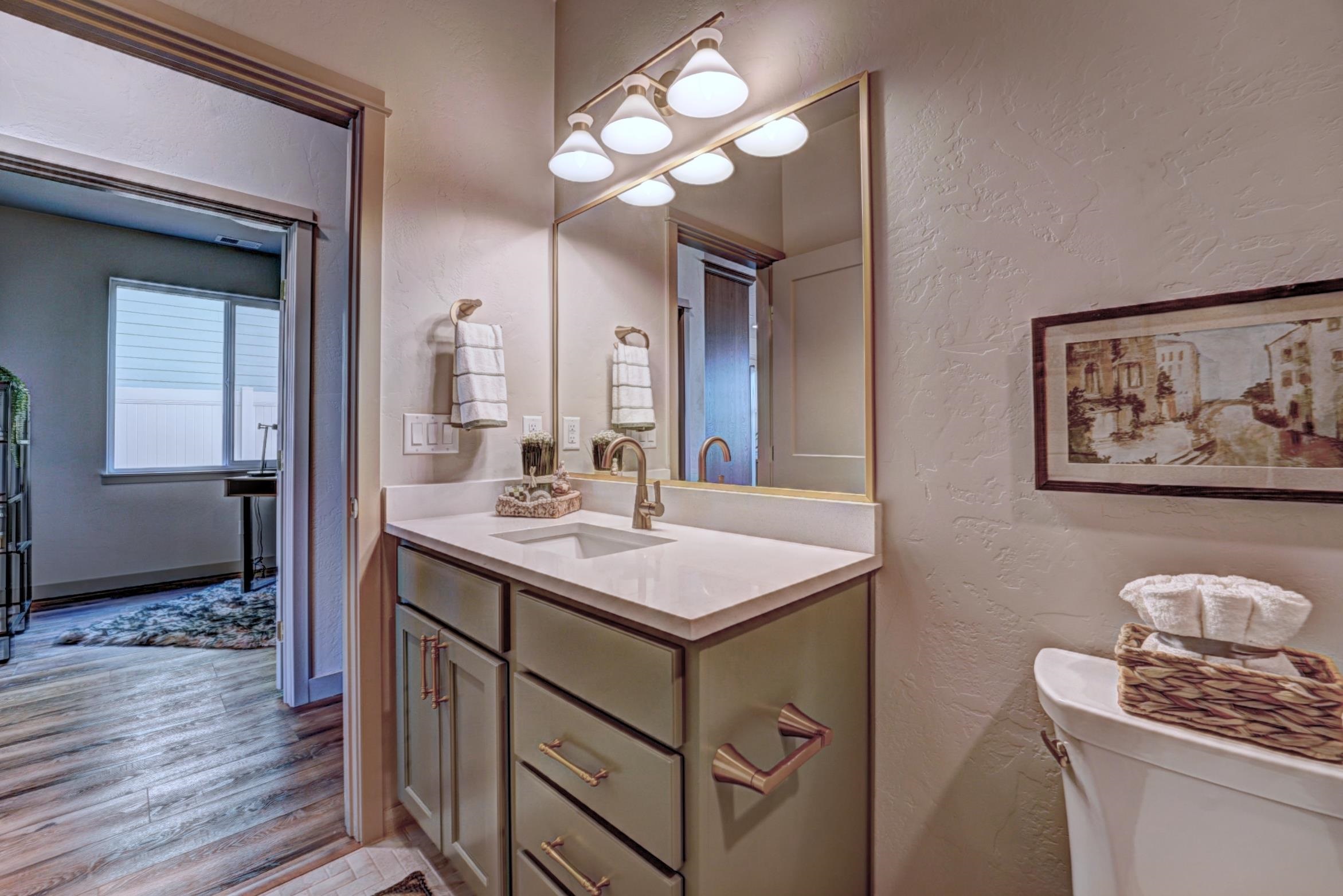 1985 Tomochic Drive Fruita, CO 81521 - Photo 27 of 41 a bathroom with a sink a vanity and a mirror
