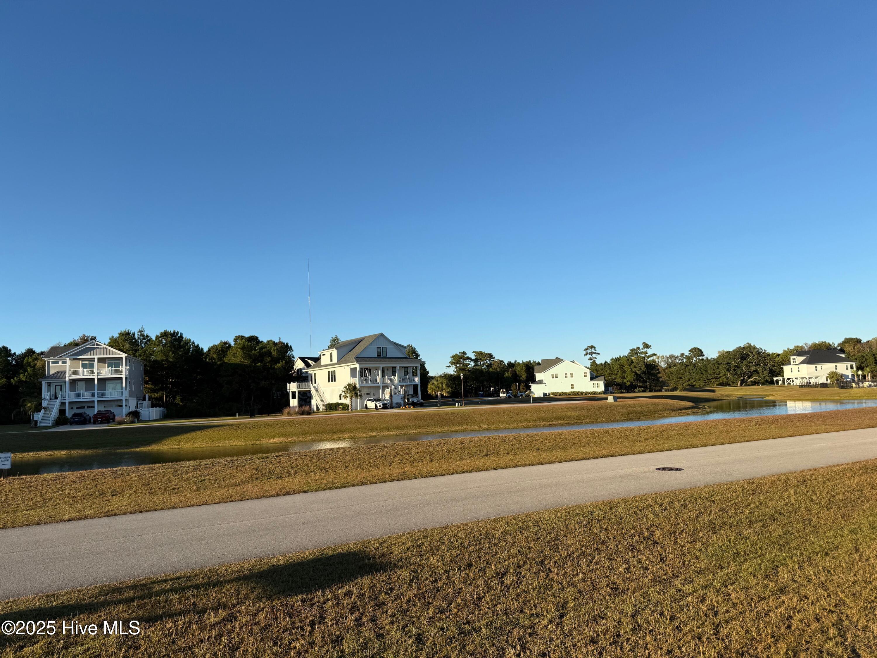157 Whispering Pine Lane Holly Ridge, NC 28445 - Photo 4 of 7 View Across the Lake
