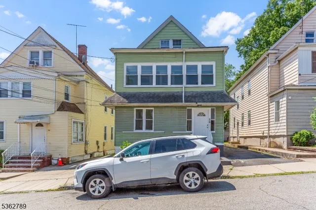 a car parked in front of a house