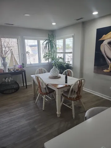 a view of a dining room with furniture and window