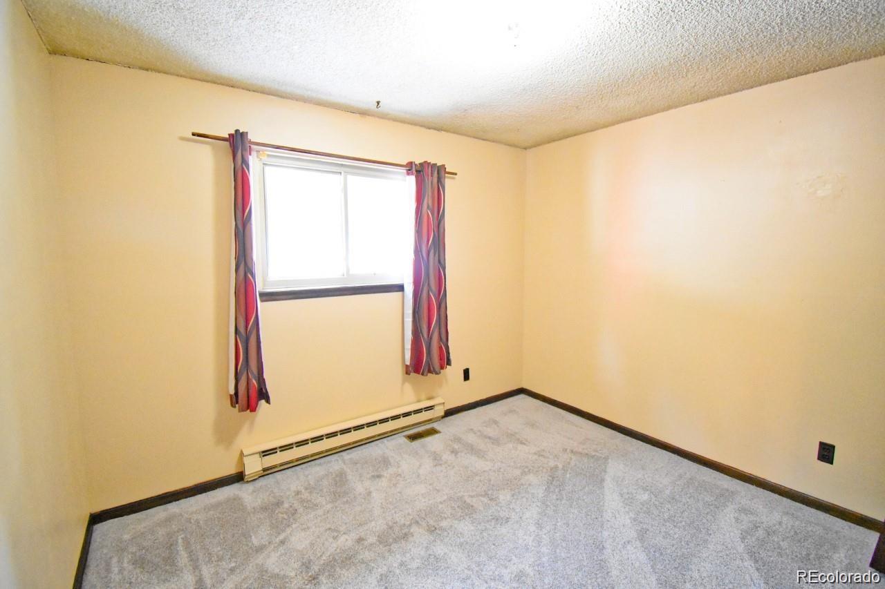 19424 Silver Ranch Road Conifer, CO 80433 - Photo 11 of 17 an empty room with a window