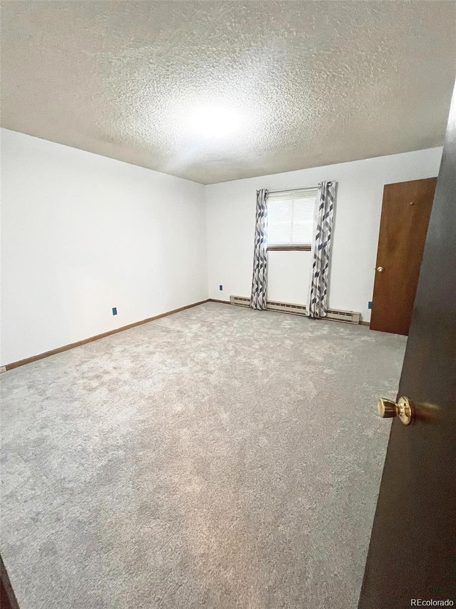 19424 Silver Ranch Road Conifer, CO 80433 - Photo 8 of 17 an empty room with windows