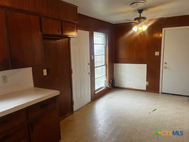 a view of empty room with closet and windows