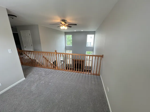 a view of a hallway with windows