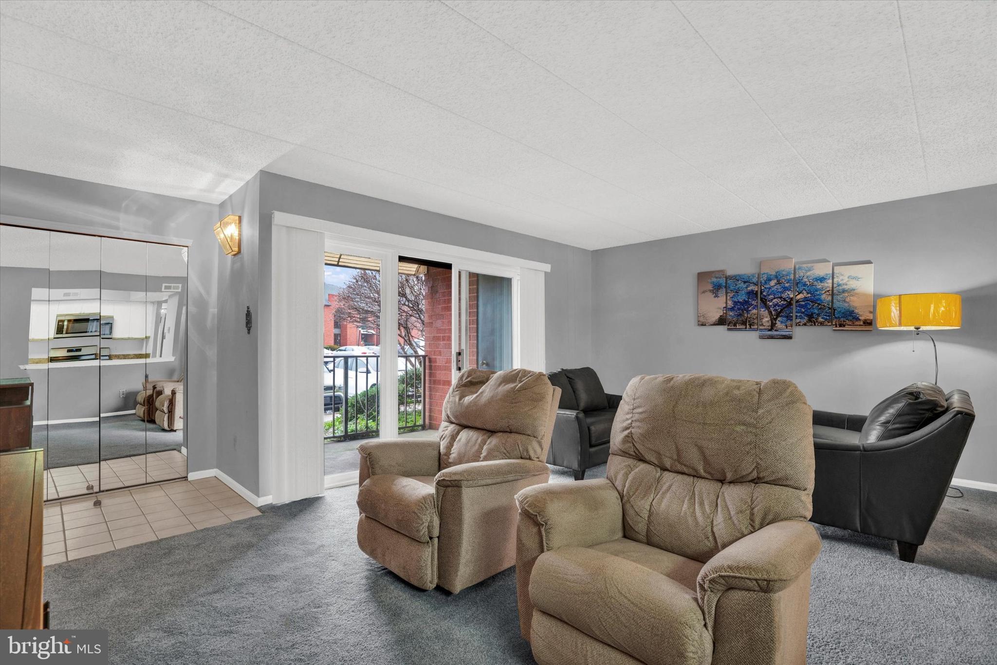 2015 Welsh Road, Unit A3 Philadelphia, PA 19115 - Photo 3 of 18 Living Room with sliding glass door to patio