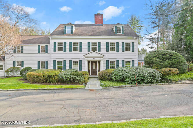 23 Bobolink Lane Greenwich, CT 06830 - Photo 1 of 47 a front view of multi story residential apartment building with yard and green space