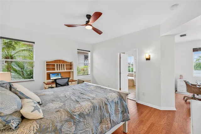 a bed room with a bed and a lamp