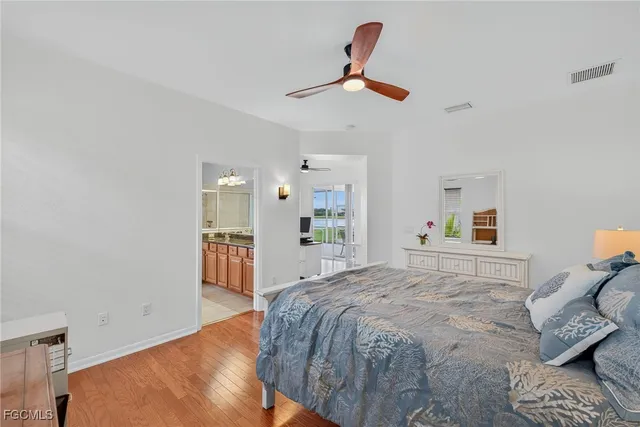 a bedroom with a bed and dresser