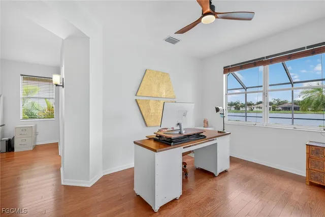 a room with wooden floor and a window