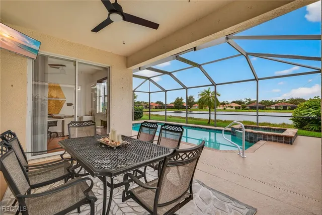 a view of a patio with a table and chairs