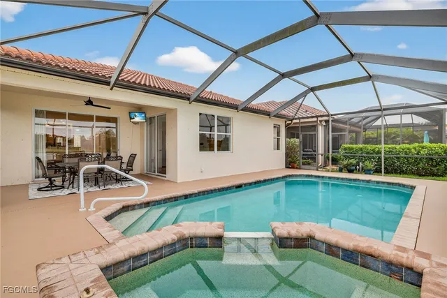 a view of a swimming pool with a patio