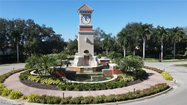 a view of a house with a small yard and sitting area