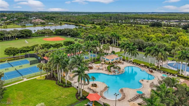 an aerial view of residential house with outdoor space and lake view